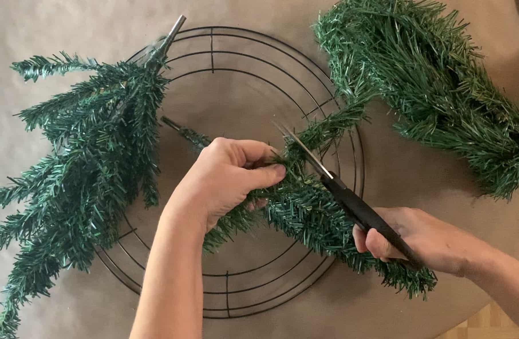 Cutting wired garland.