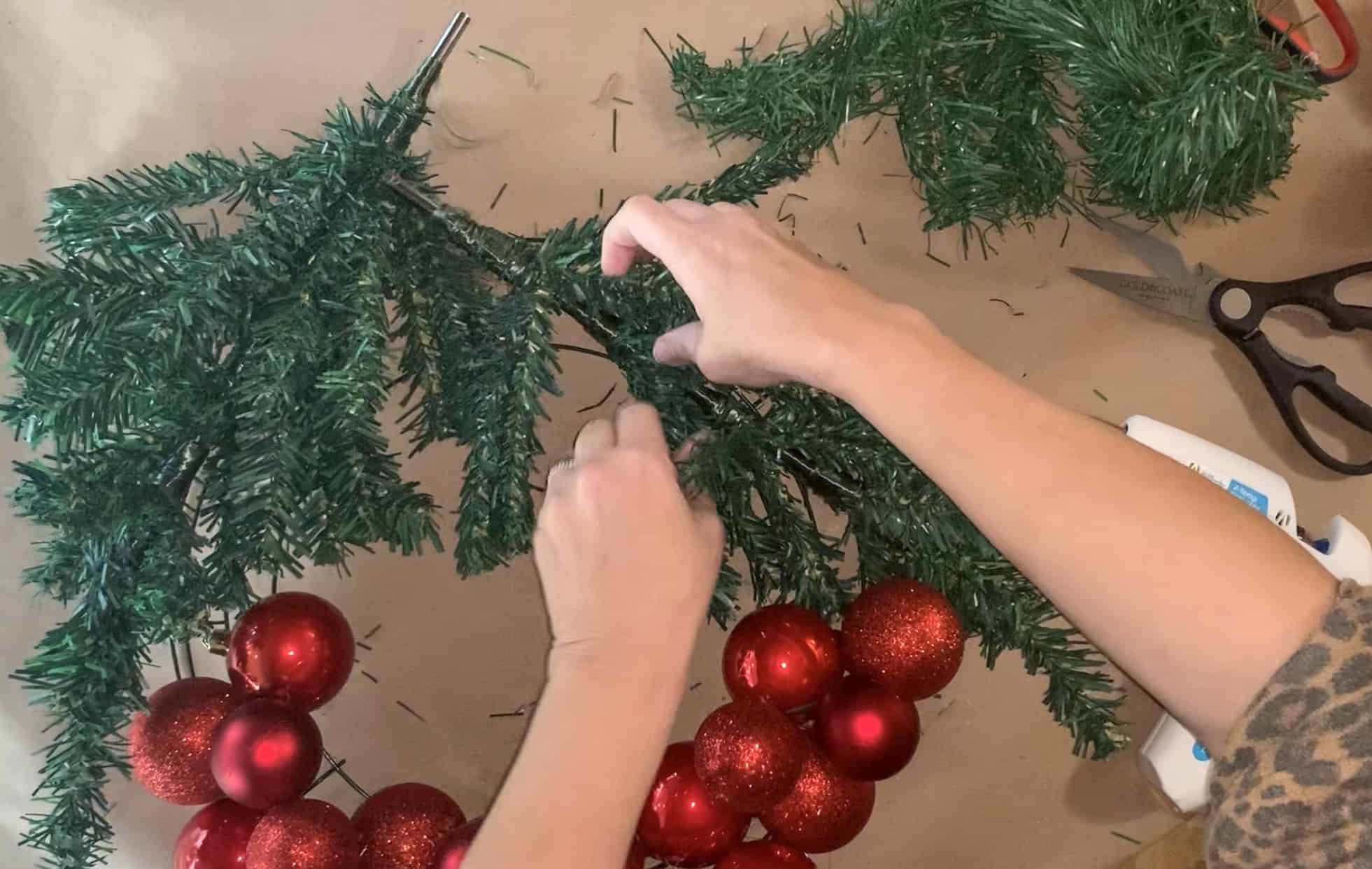 Securing trees in place using wired garland.