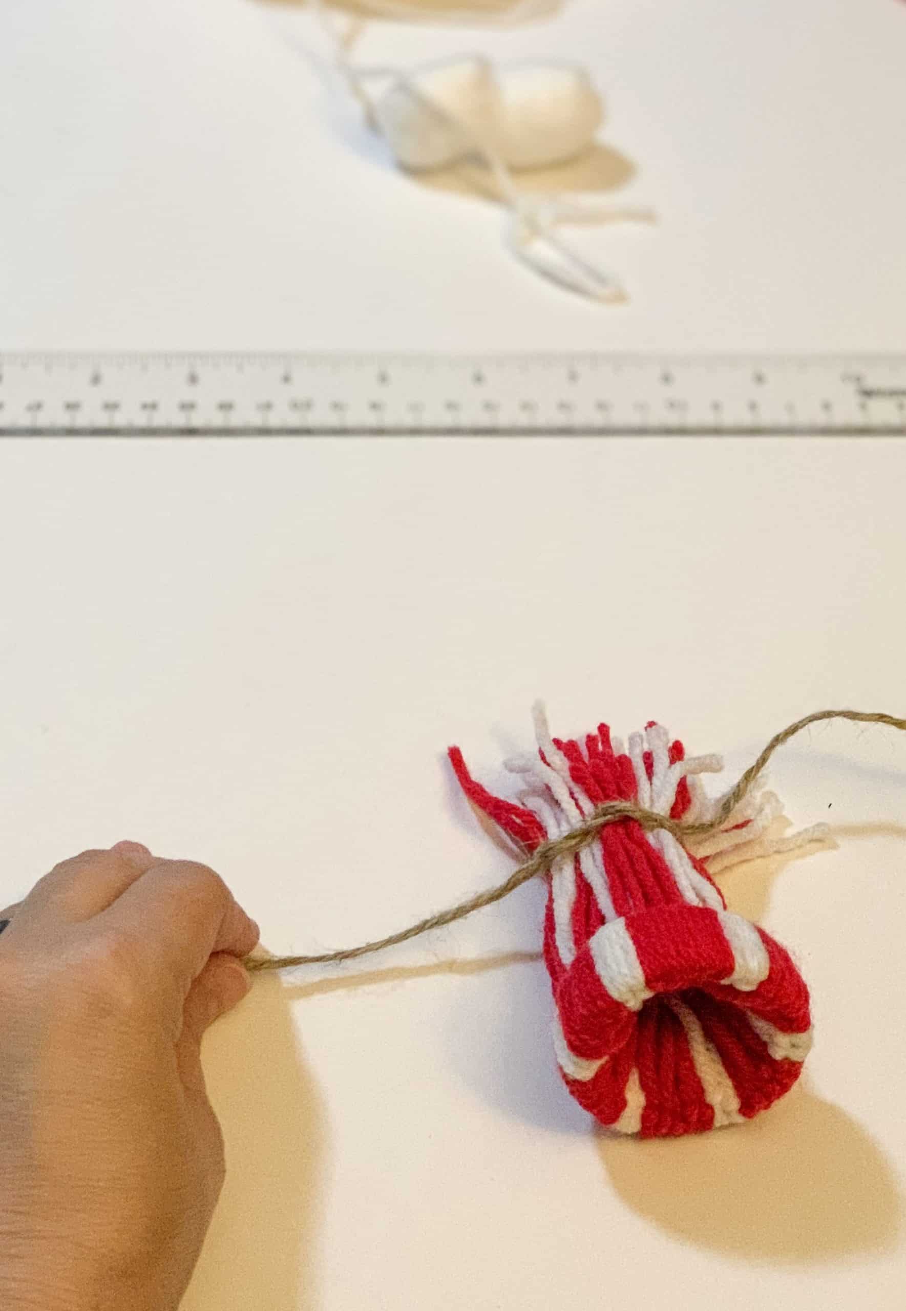 securing the top of winter hat ornament with jute