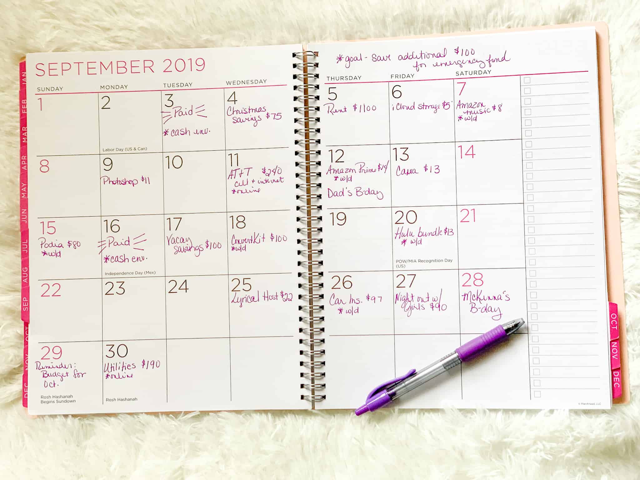Monthly Budget Calendar handwritten in a planner.