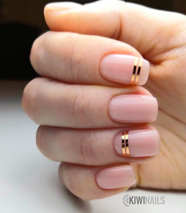 dusty rose nails with gold accents