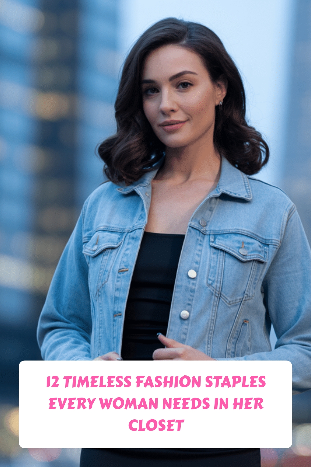 A woman in a denim jacket over a black top stands outdoors in a city setting. Text reads, 12 Timeless Fashion Staples Every Woman Needs in Her Closet.
