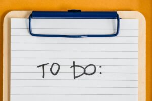 Clean and simple image of a to-do list on a clipboard with lined paper.