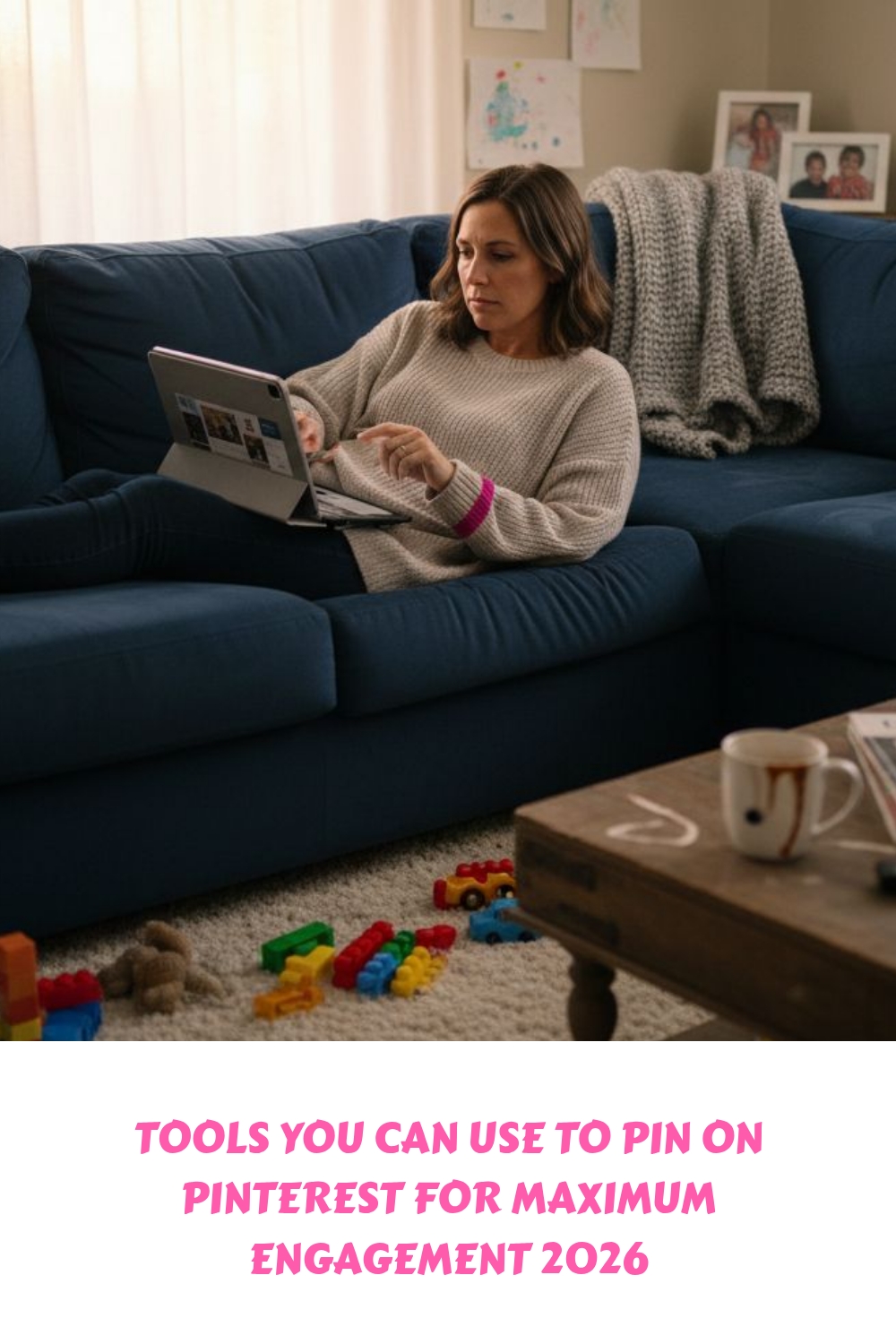 A woman sits on a blue couch using a laptop, surrounded by childrens toys on the floor and a blanket. The text below reads, “TOOLS YOU CAN USE TO PIN ON PINTEREST FOR MAXIMUM ENGAGEMENT 2026.”.