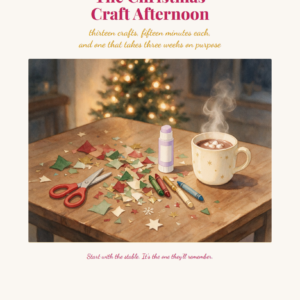 A cozy table with Christmas craft supplies, paper stars, scissors, glue, and a mug of hot chocolate topped with marshmallows. A decorated tree and lights glow softly in the background.
